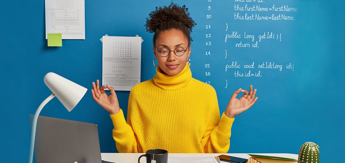 Employee meditating in the workplace