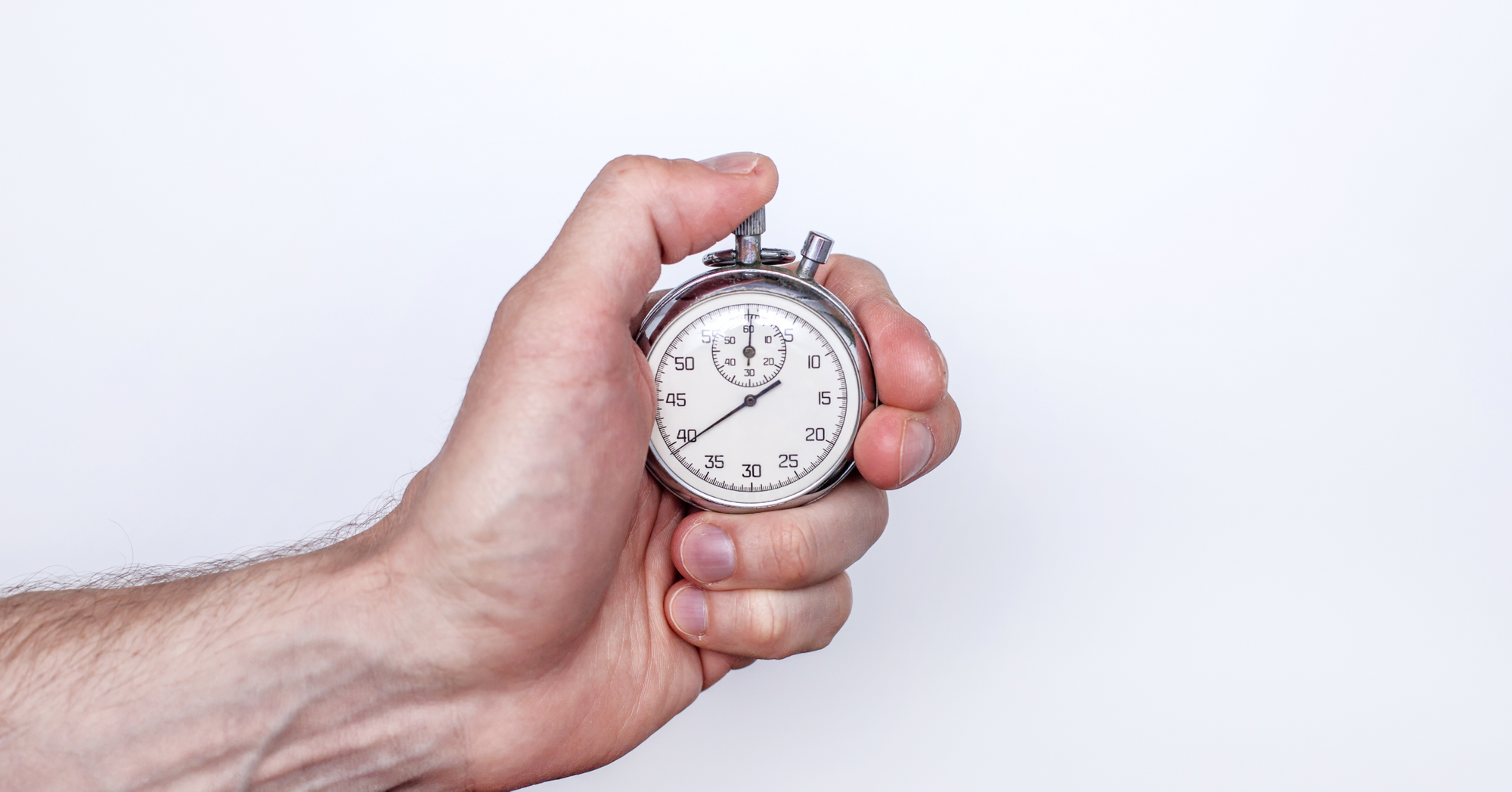 Someone pressing buttons on a handheld timer clock