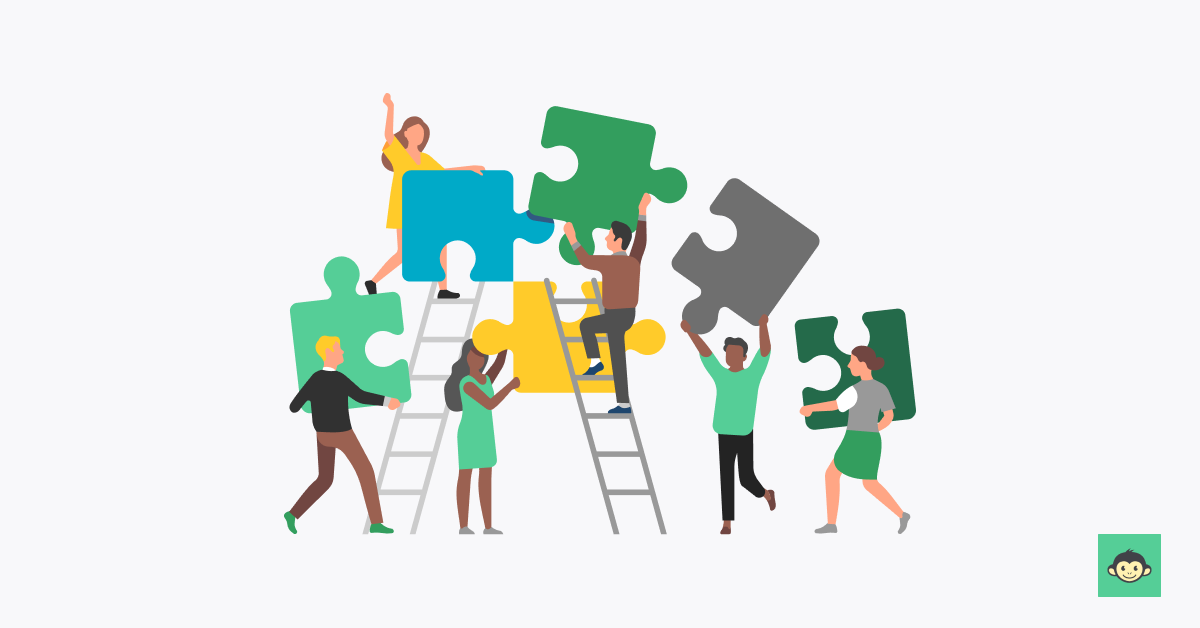 Employees are working together in connecting puzzle 