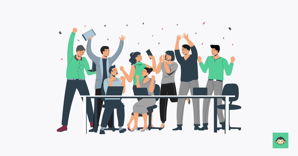 Employees with high morale celebrating in the workplace