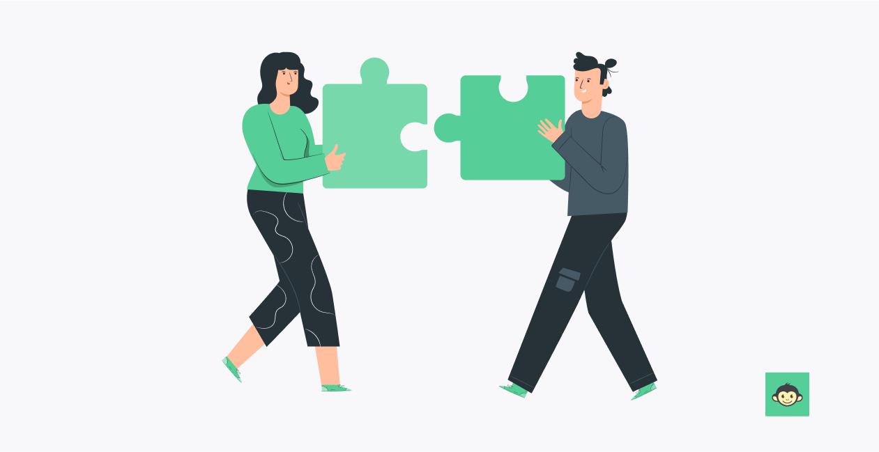Two employees are connecting two puzzle