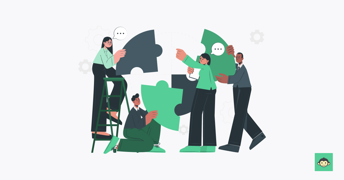 Employees connecting puzzles together in the workplace 