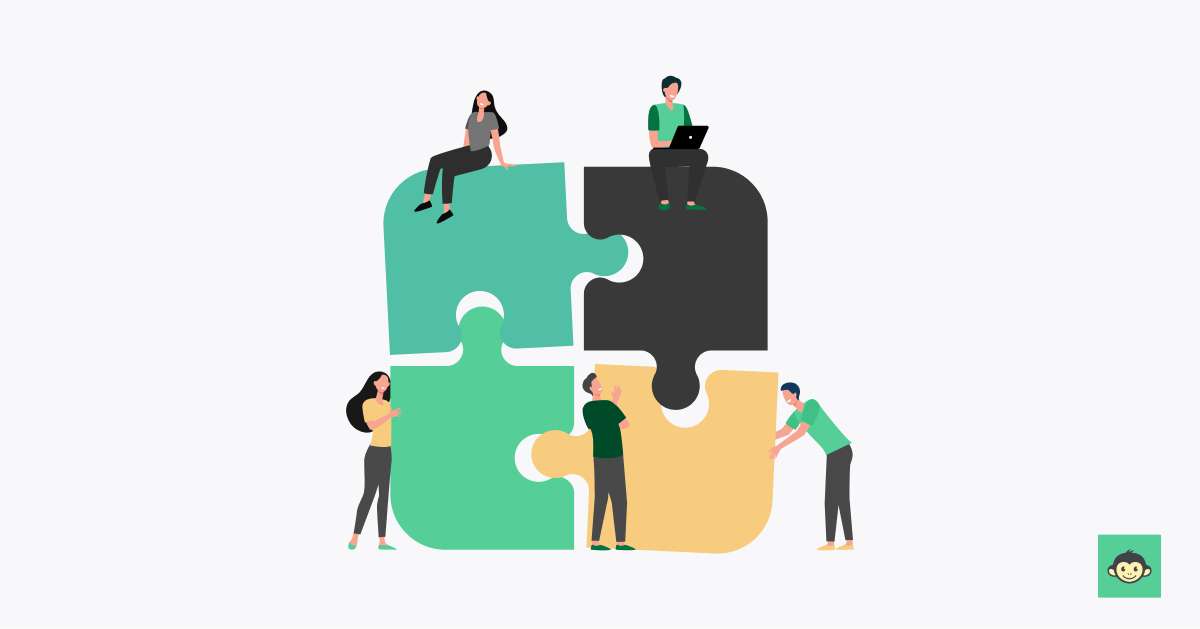 Employees are connecting puzzles in the workplace together