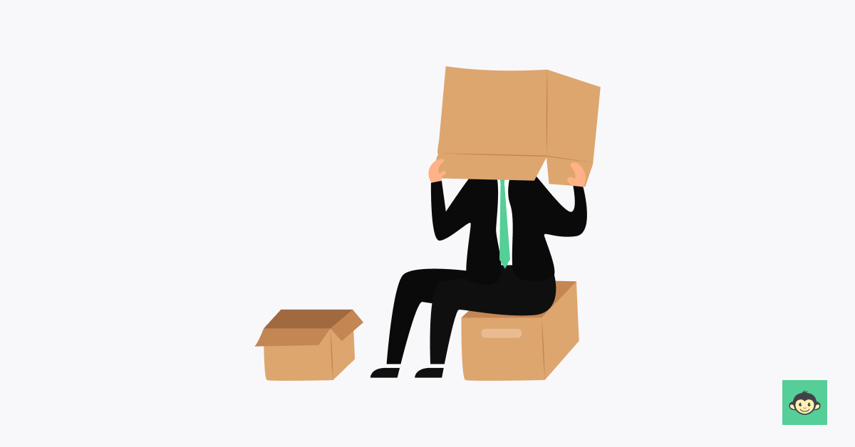 Employee sitting in the workplace with a box covering the face
