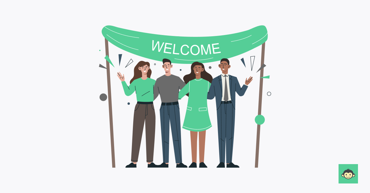 Existing employees are welcoming a new employee with a welcome banner 