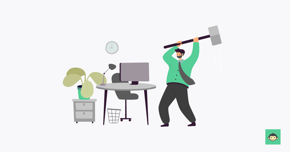 Employee smashing the desk with a huge hammer 