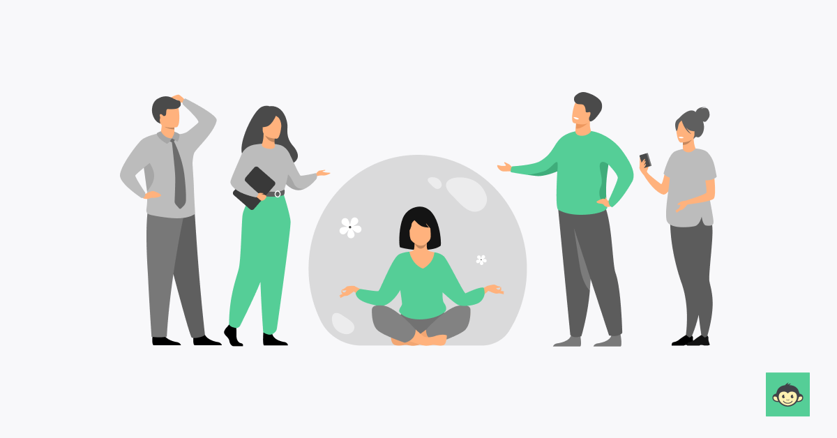 Employee meditating in a bubble while other employees are standing around