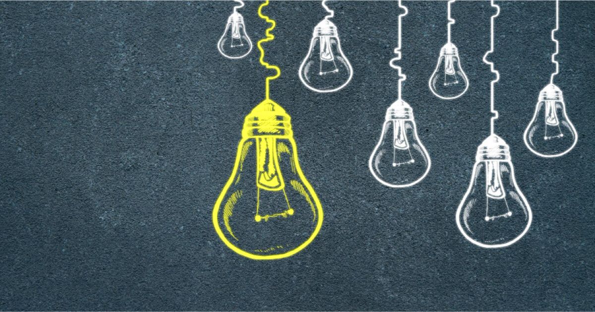 A yellow bulb illustration amongst a group of other white illustrations