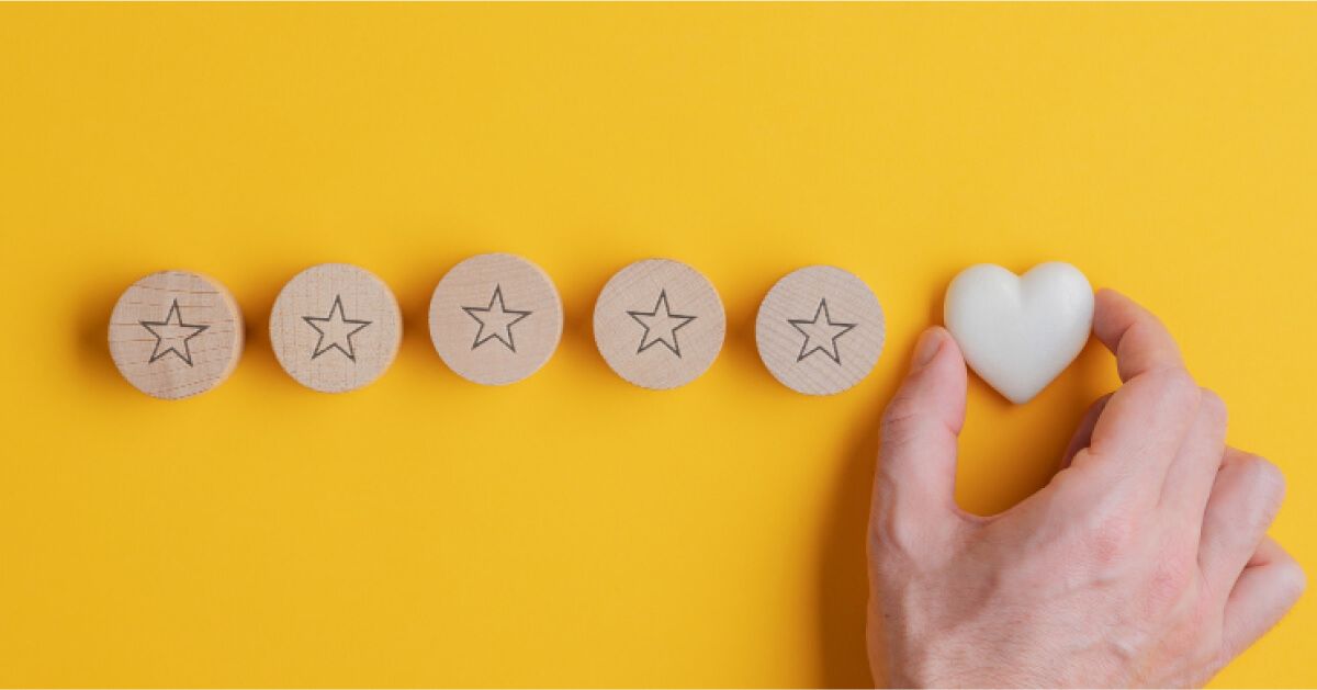 Someone placing a heart icon at the end of a series of star chips
