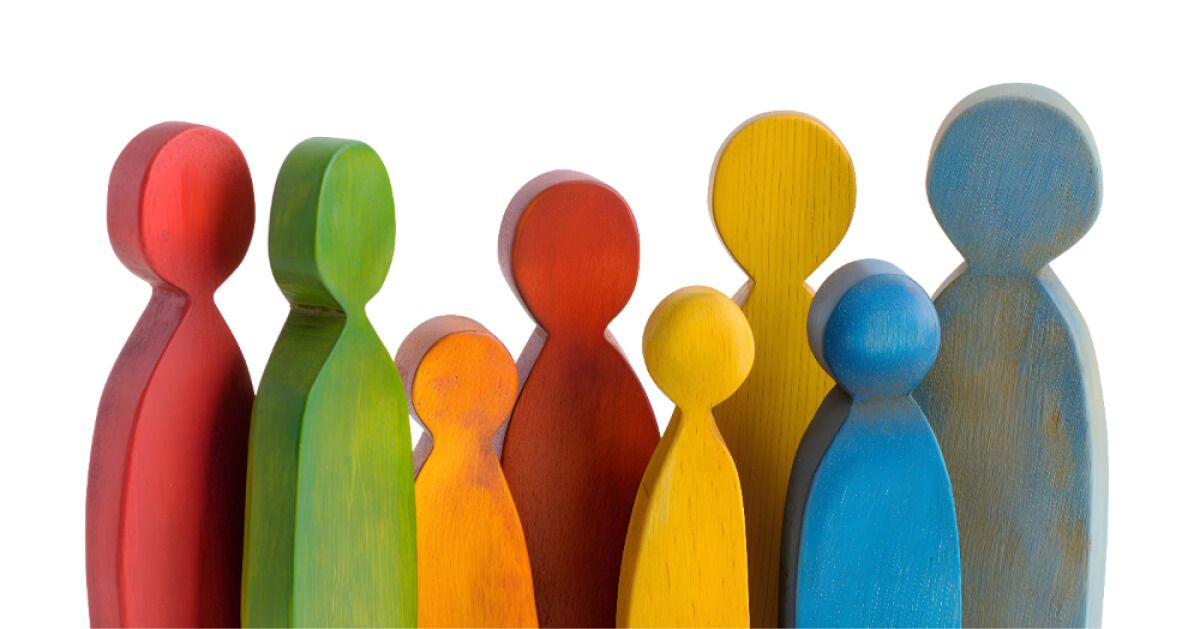 Diverse colored people shaped wooden pieces