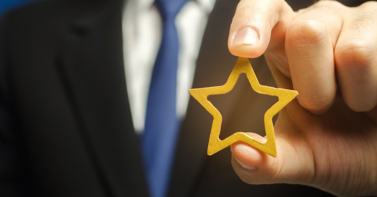 A hand holding star