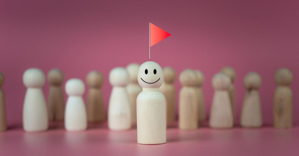 A smiling wooden pawn