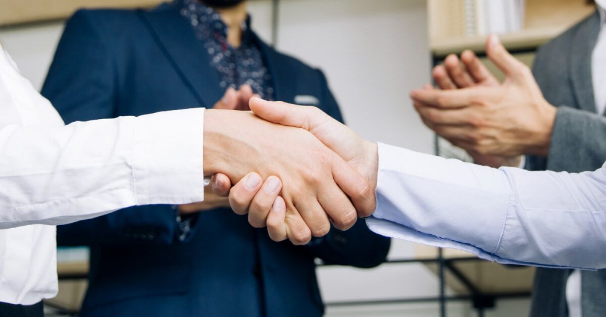 Employees appreciating and greeting each other