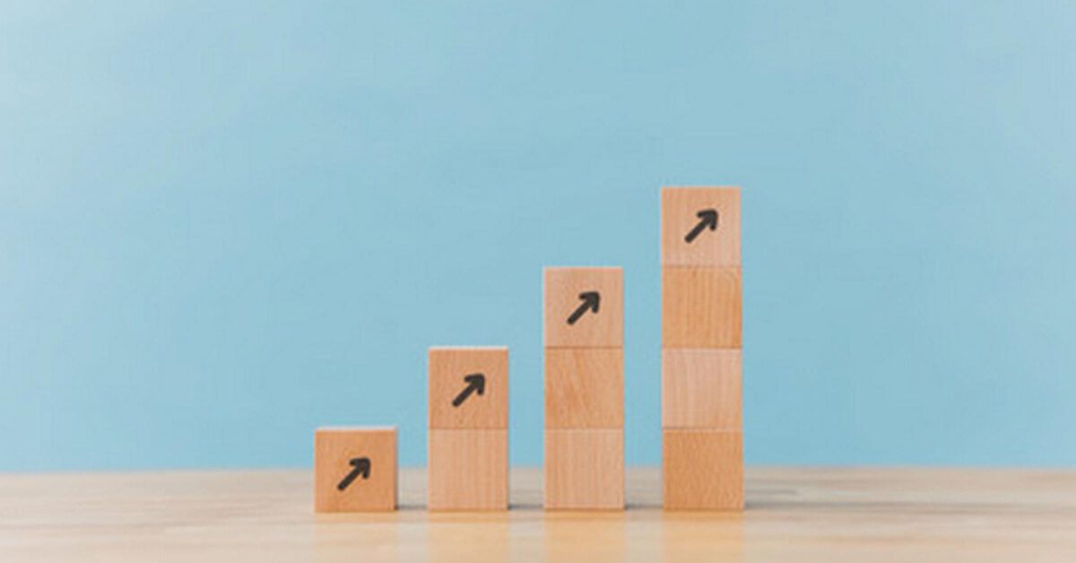 A stepped arrangement of wooden blocks with upward arrows