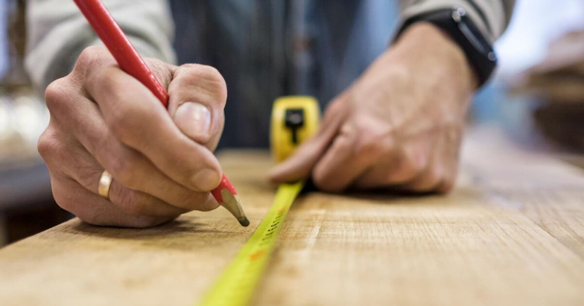 A hand taking measurement