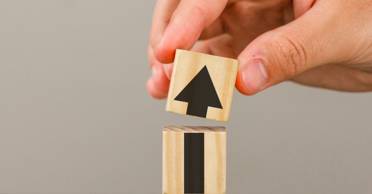 A wooden block with arrow symbol