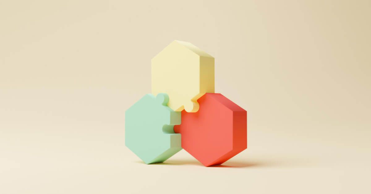 Three vividly colored hexagonal puzzle blocks