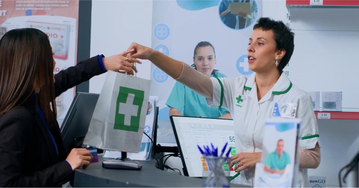 A nurse handing over medicine