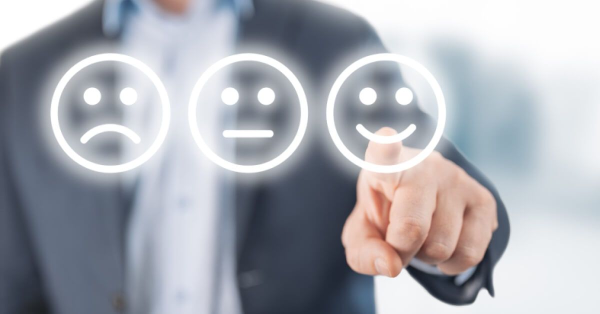 Person pointing finger at a varied emoji scaling system