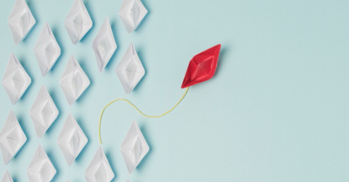 A paper boat is getting separated from rest