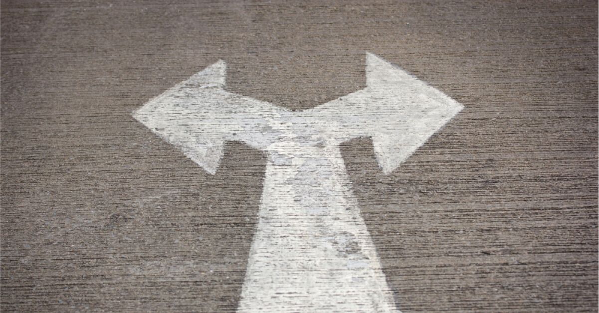An arrow on a road goes both ways