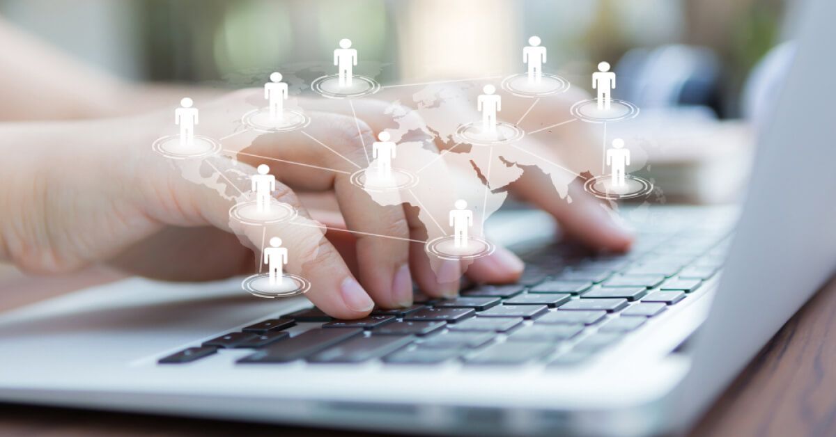 Person typing on keyboard with graphic elements over it