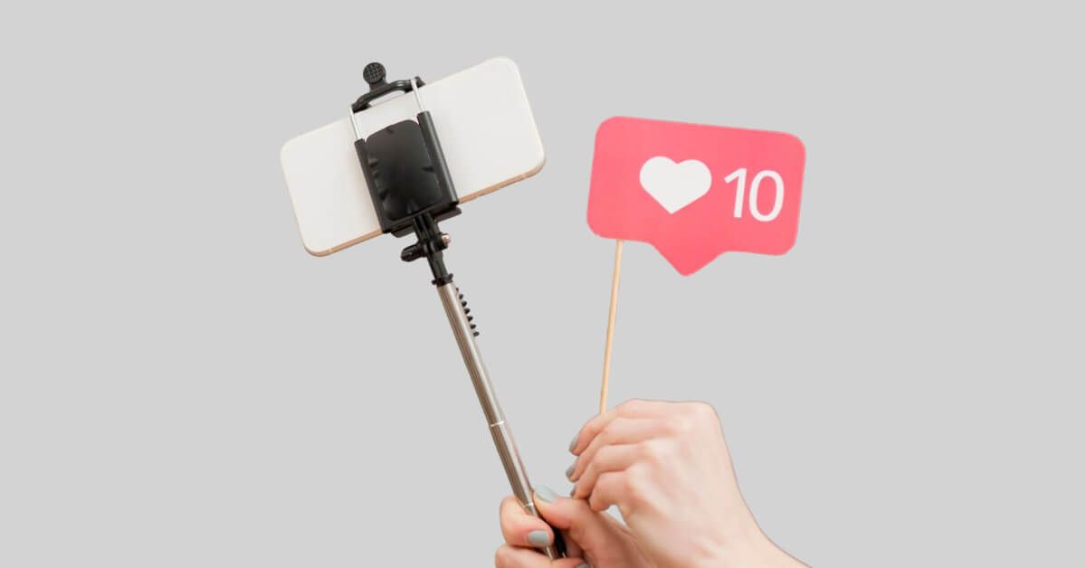 Person holding a phone and a like count