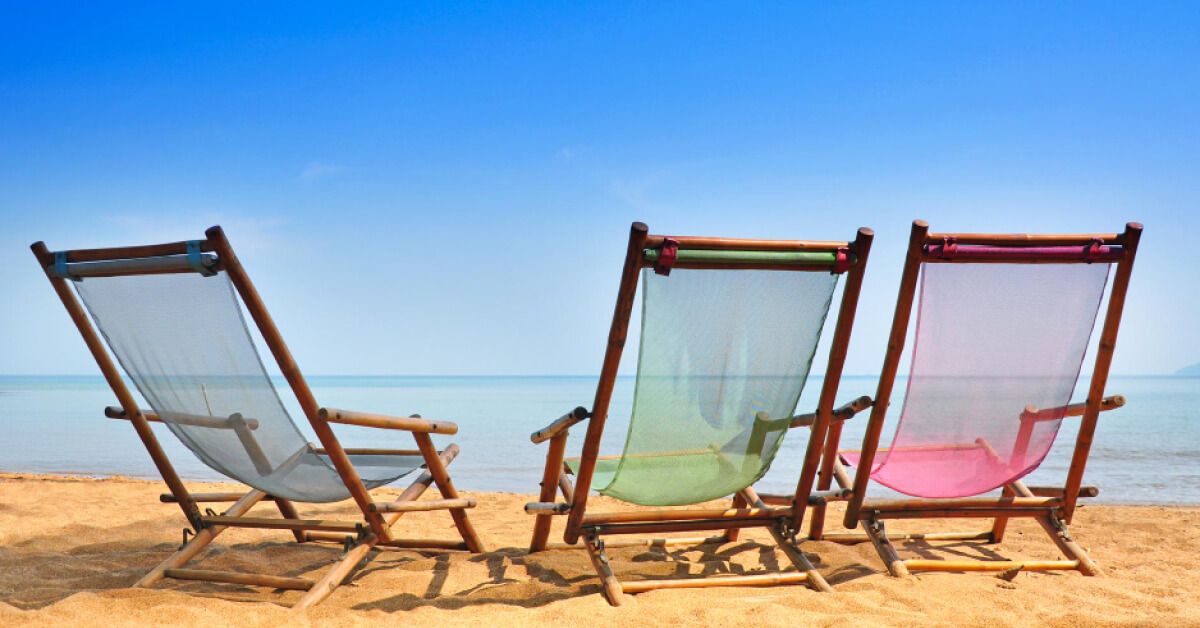 Three chairs by the beachside