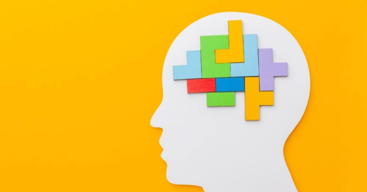 Interlocked variably coloured blocks inside a head