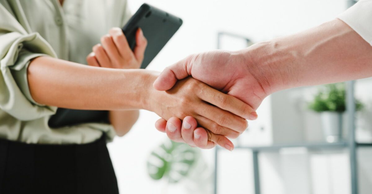 Two people shaking hands