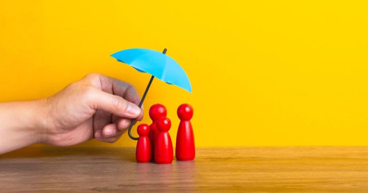 A family holding umbrellas