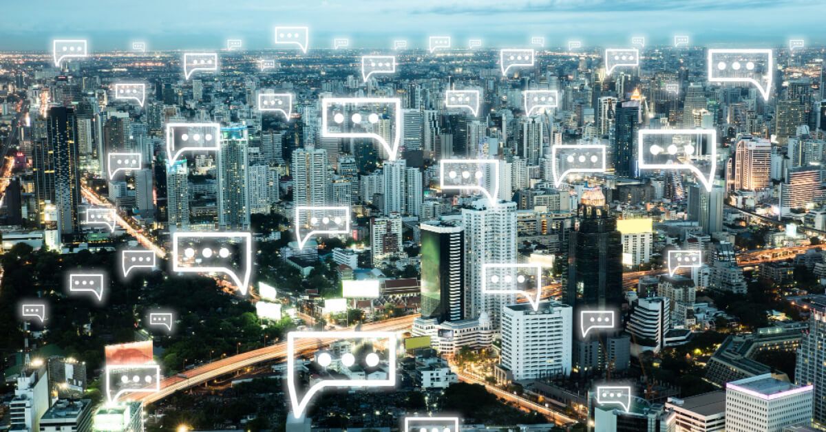 A cityscape with holographic message boxes next to buildings