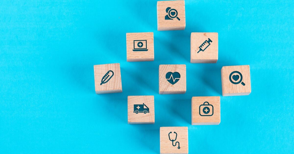 Set of wooden blocks with graphics against a blue backdrop