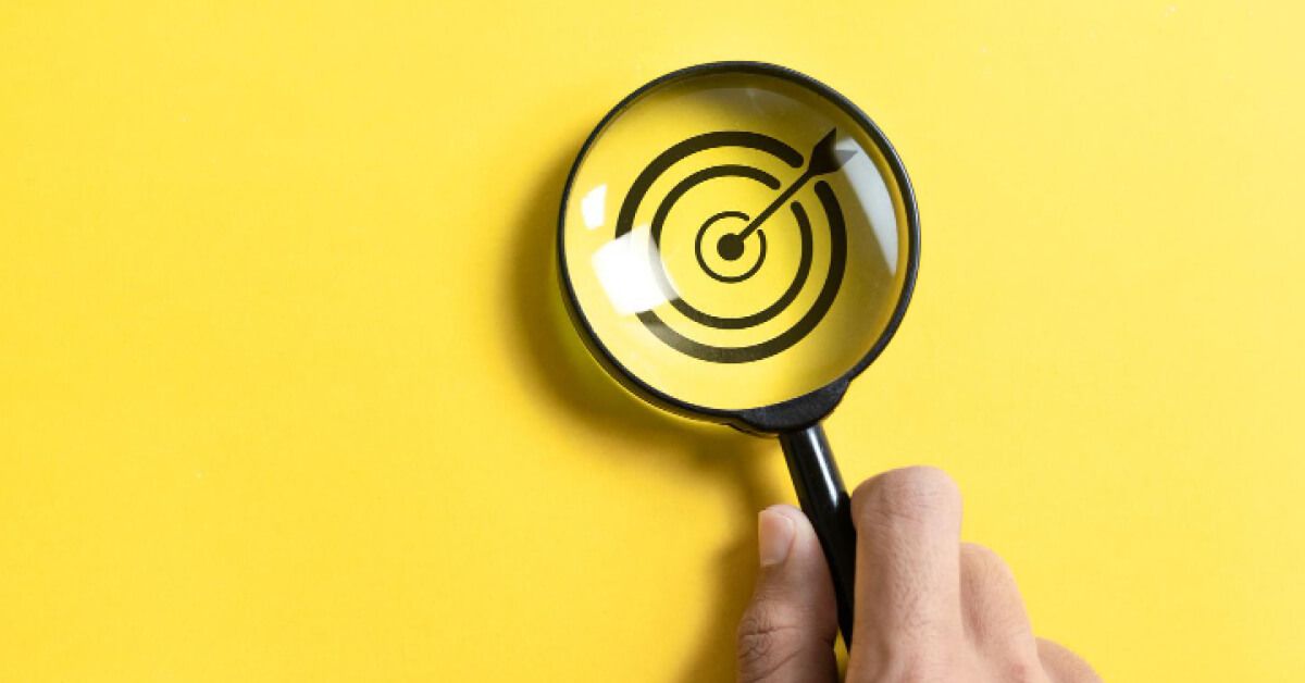 Magnifier glass over a target board graphic