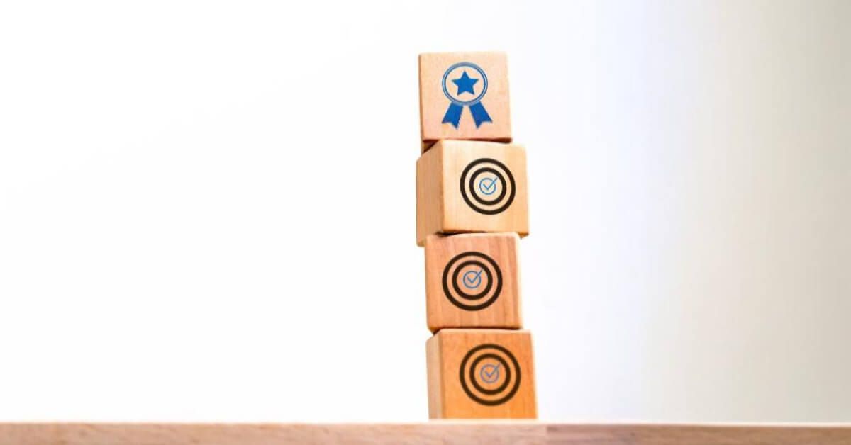 Stack of wooden blocks with vector visuals on them