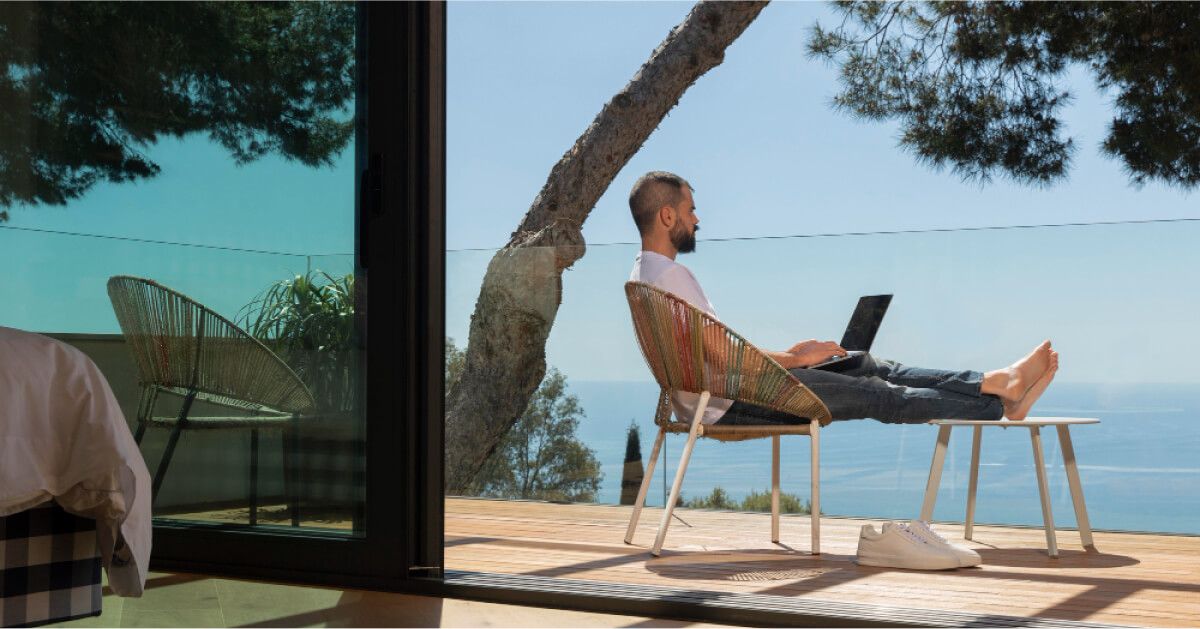 Employee working on a laptop in a balcony