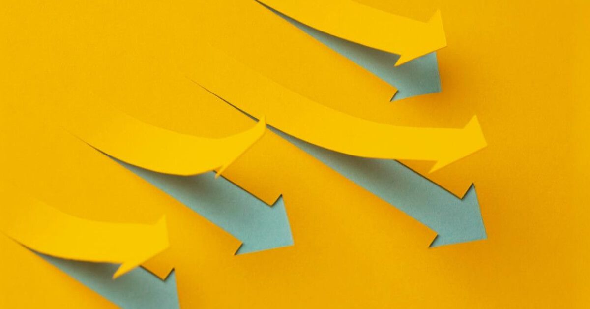 Cutouts of upward moving yellow arrows