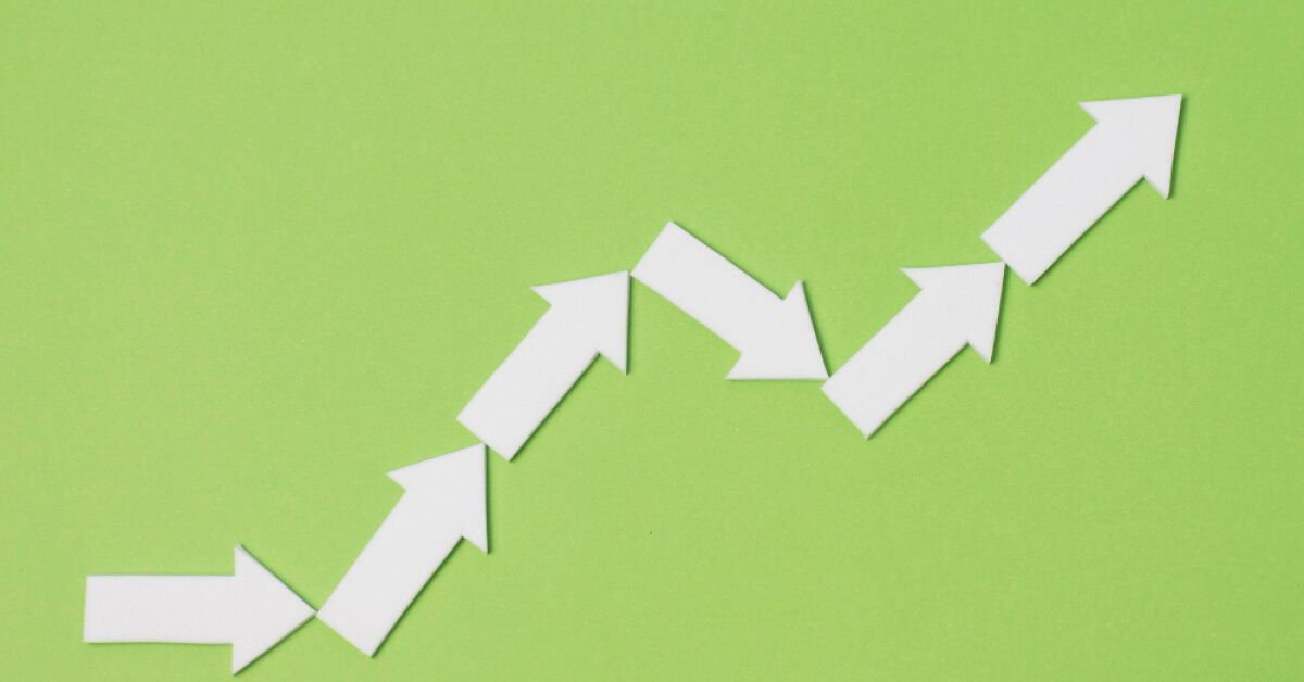 Upward trend graph using white arrows