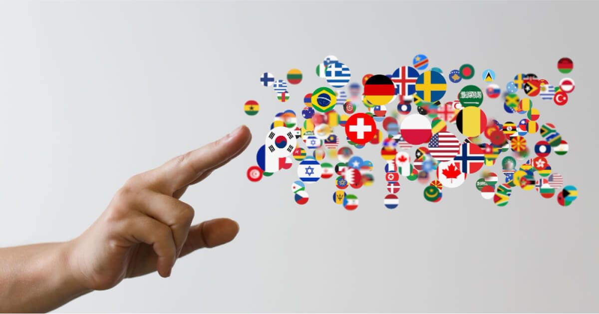 Person pointing at a cluster of flag icons