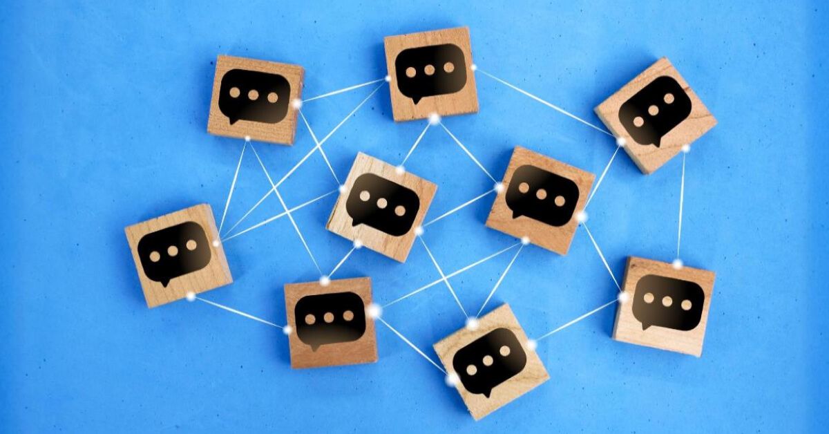 Network of wooden blocks with conversation box graphics