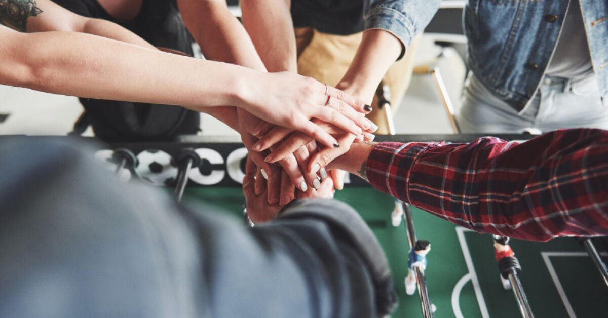 Employees participating in a group cheer