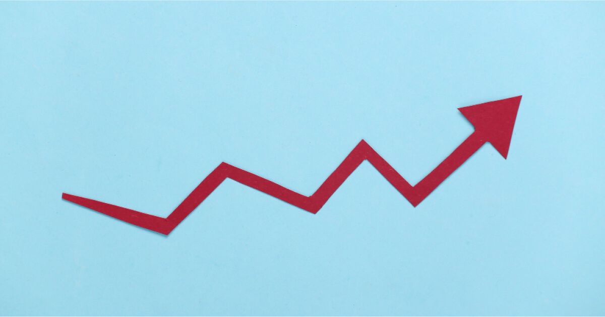 Upward moving red arrow
