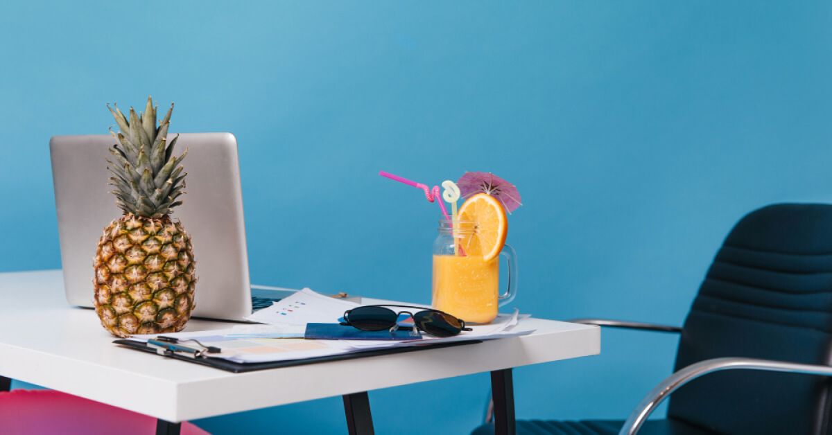 A remote work desk with tropical elements
