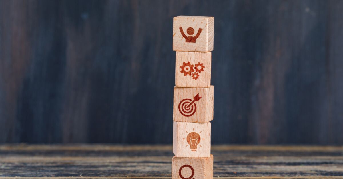 Stack of wooden blocks with vector visuals on them