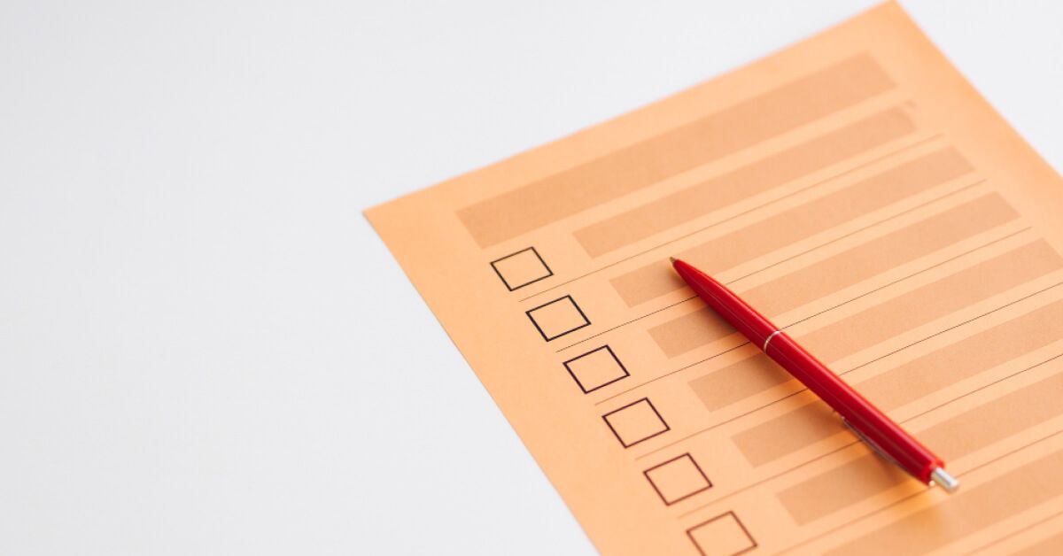 Checklist with a red pen