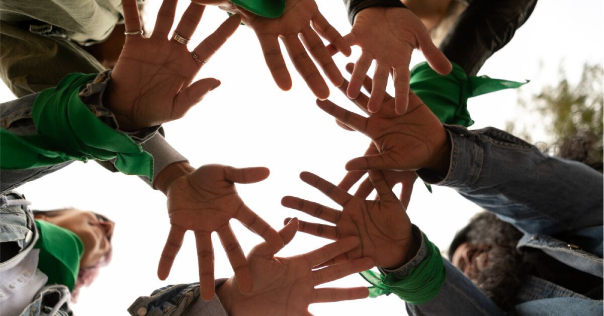 A lot of people putting their hands together