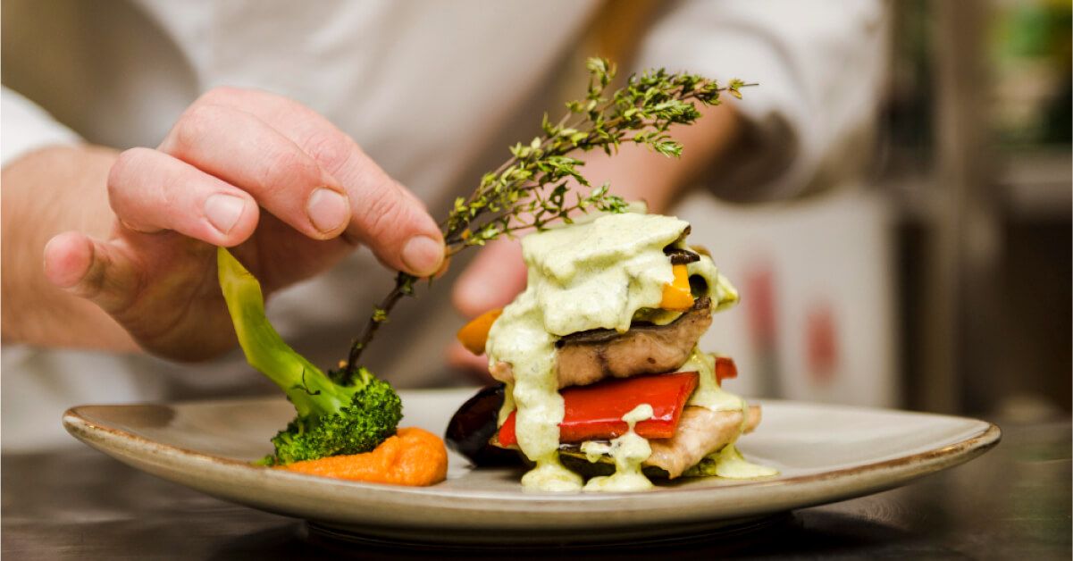 A chef plating his food