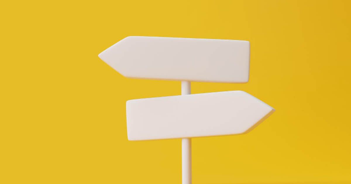 White direction boards pointing in different directions
