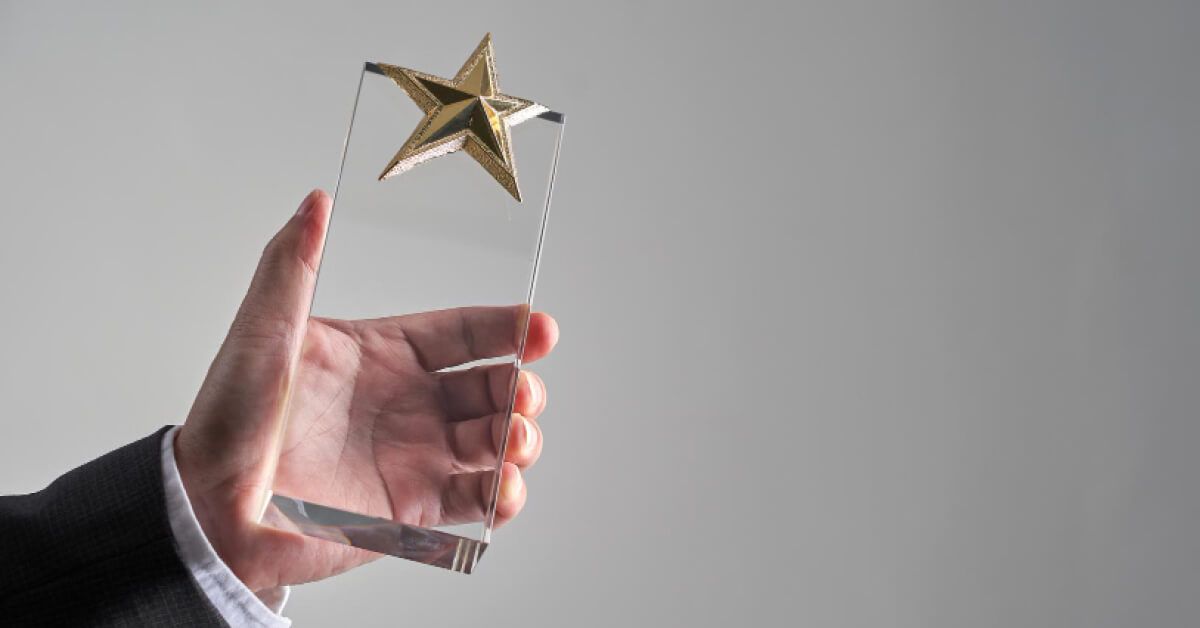 A man holding an award