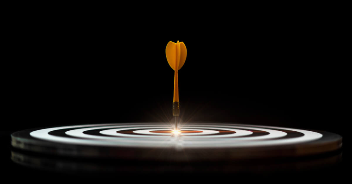 Yellow dart hitting the bulls-eye